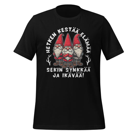 Hauska joulupaita, jossa on teksti 'Hetken kestää elämä, sekin synkkää ja ikävää' ja kolme tonttua vakavalla ilmeellä.